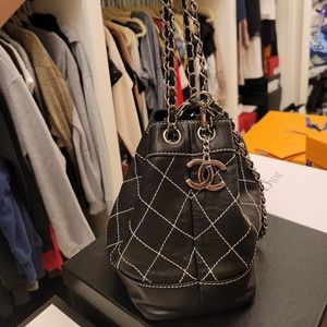 Black strawstring bucket chanel bag.